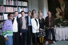 Photo of the group standing in a library.