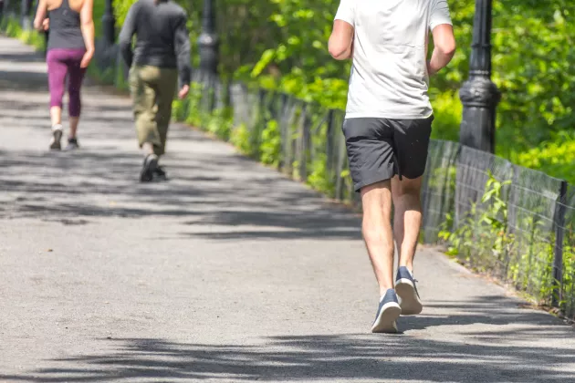 A man running in a park.