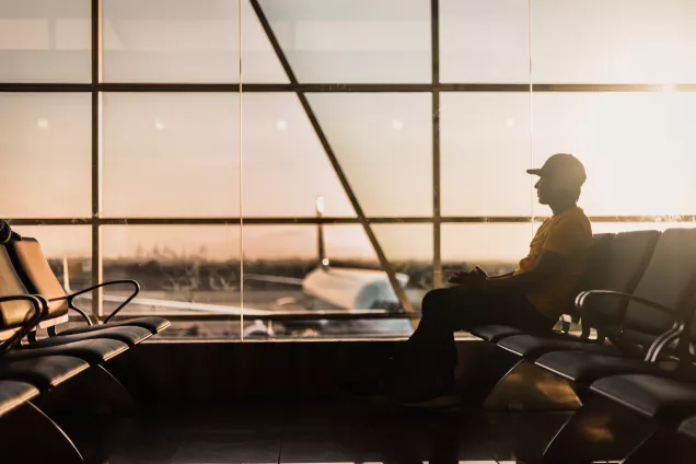 man waiting at an airport