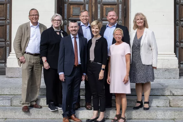 The University Management in front of the University Building. 